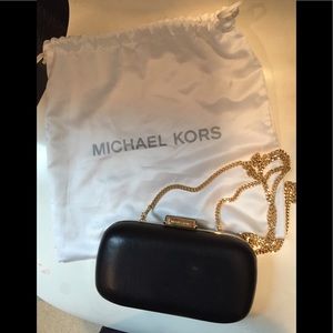 Michael Kors Black clutch bag with gold chain